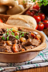 Beef Bourguignon stew served with baguette