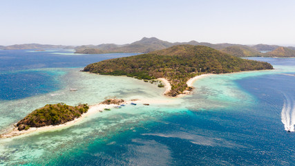 Fototapeta na wymiar Tropical islands with white beaches. Turquoise lagoon and coral reefs, top view. Philippines, Palawan