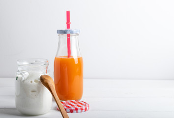 yogurt with fruit on a breakfast table on a white background