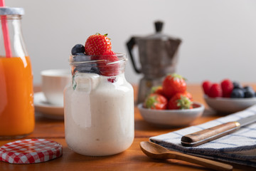 yogurt with fruit on a breakfast table