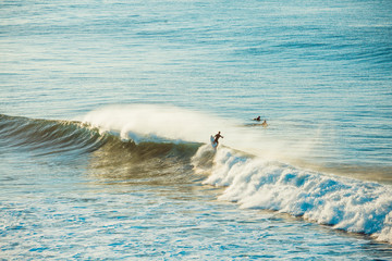 Fototapeta premium Surfers and Waves at Bells Beach, Australia