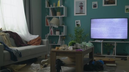 Zoom Out of concept of the mess in the living room after the party