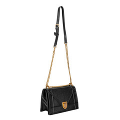 Black female small bag with a long gold chain on a white background. Side view