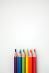Fototapeta premium LGBT concept, and human rights minimal concept, colored pencils arranged like a LGBT flag, minimal design