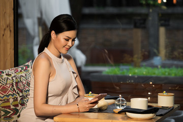 Smart Beautiful Asian Young Woman in Fashion Make Up Evening Gown have Dinner in India mix Japanese...