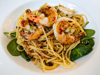 Delicious Aglio Olio served with fresh prawns.