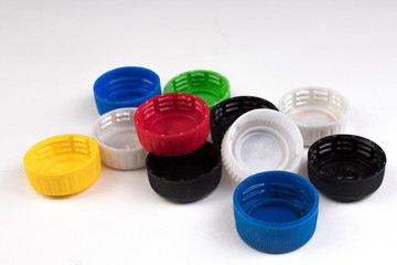 many plastic covers of different colors, isolated on white background.