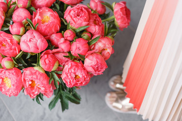 Coral peonies in a metal vase. Beautiful peony flower for catalog or online store. Floral shop concept . Beautiful fresh cut bouquet. Flowers delivery