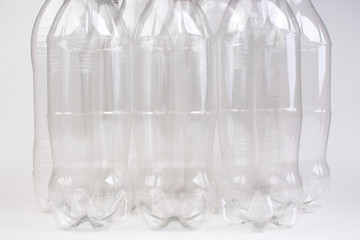 collection of empty used plastic bottles on white background.