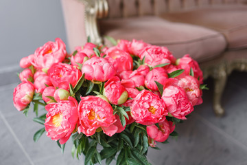 Coral peonies in a metal vase. Beautiful peony flower for catalog or online store. Floral shop concept . Beautiful fresh cut bouquet. Flowers delivery