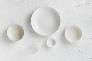 Set of empty plates on a white background top view