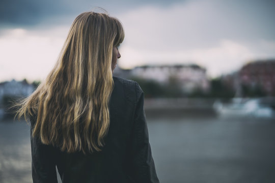 Portrait Of Lonely And Pensive Woman Who Is Looking At Distance.