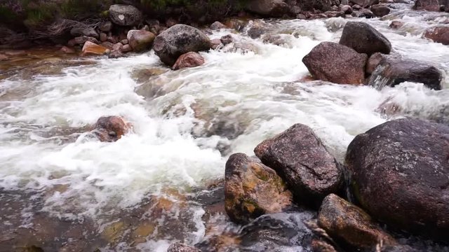 Rapids with strong currents and whitewater in the river dee in the cairngorms in the schottish Highlands, Scotland, United Kingdom.