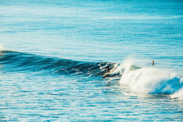 Surfers and Waves at Bells Beach, Australia