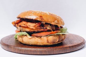 Big tasty burger on background on the wooden table