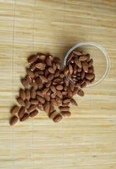 Healthy food  for background image close up almond nuts. Texture Nuts on the cup plate
