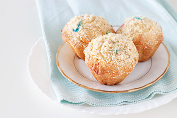 Healthy Apple Oats streusel Muffins on white plate. Selective focus. Copy space.