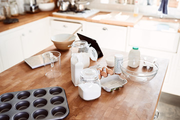 Ingredients And Baking Utensils Laid Out On Work Surface In Kitchen