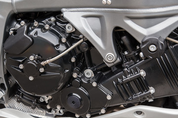 Engine parts of a racing motorcycle close-up.