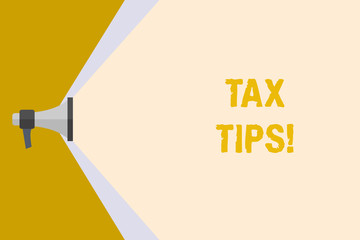 Writing note showing Tax Tips. Business concept for compulsory contribution to state revenue levied by government Megaphone Extending Capacity of Volume Range thru Wide Beam