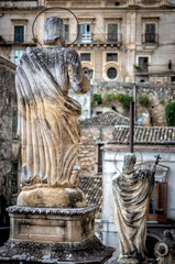 ancient town Modica and sculptures of the church or Dome of San Pietr , Sicily, Italy
