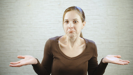 Woman shrugs does not know anything