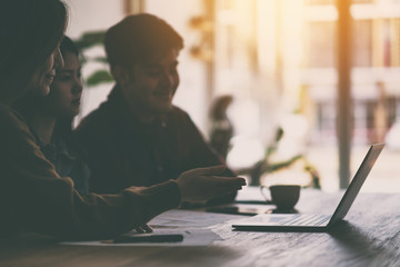 Three businessman working and discussing business together in a meeting