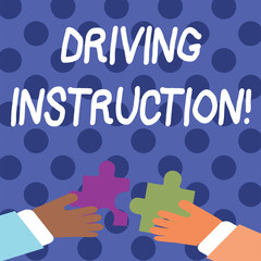 Handwriting text writing Driving Instruction. Conceptual photo detailed information on how driving should be done Two Hands Holding Colorful Jigsaw Puzzle Pieces about to Interlock the Tiles