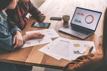 Three businessman working and discussing business together in a meeting