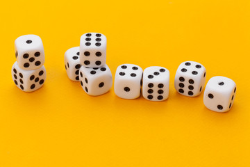 dice on a yellow background