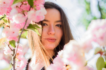 Fototapeta premium blossom smell, allergy. woman in spring flower bloom. skincare and spa. Natural cosmetics for skin. girl in cherry flower. Sakura tree blooming. natural summer beauty. Spring mood