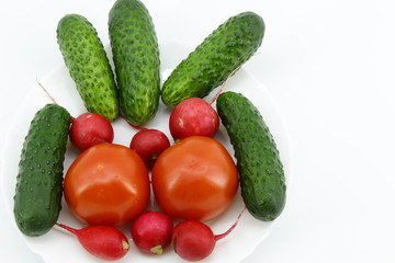 Tomatoes, cucumbers, radish on white background
