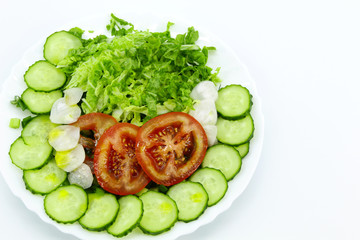 Tomatoes, cucumbers, Peking cabbage, red radish, dill, parsley, green onion, linseed oil on white background