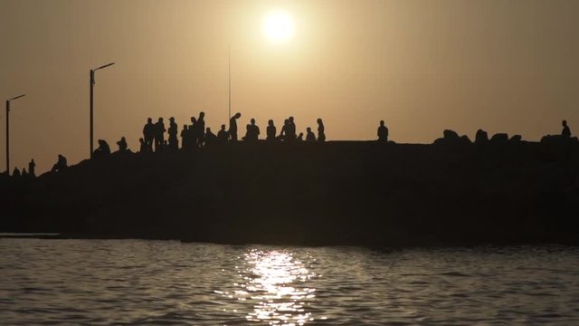 People waking at Sunset