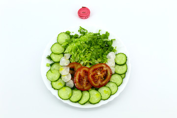 Salad of vegetables: tomatoes, cucumbers, radishes, cabbage, Peking, dill, parsley, green onions. Top measuring pink tape