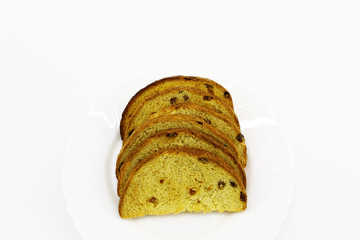Dried white bread with raisins on a plate