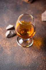 Glass of cognac or whiskey.