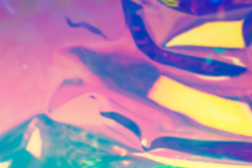 Blurry abstract iridescent holographic foil background