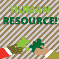 Text sign showing Huanalysis Resource. Business photo showcasing the process of hiring and developing employees Two Hands Holding Colorful Jigsaw Puzzle Pieces about to Interlock the Tiles