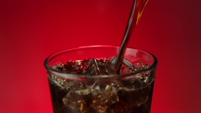 Refreshing Cola Soda Splashing in Ice