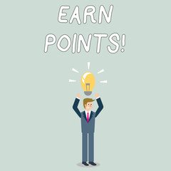 Word writing text Earn Points. Business photo showcasing collecting scores in order qualify to win big prize Businessman Standing Raising Arms Upward with Lighted Bulb Icon on his Head