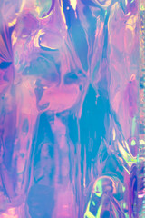 Blurry abstract iridescent holographic foil background