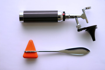 Otoscope and hammer jerk on floor ,top view