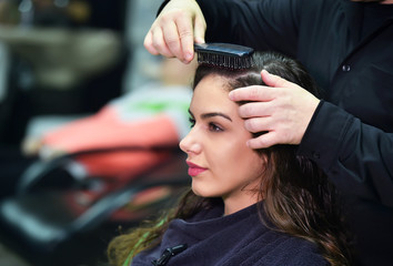 young woman in hairdresser salon
