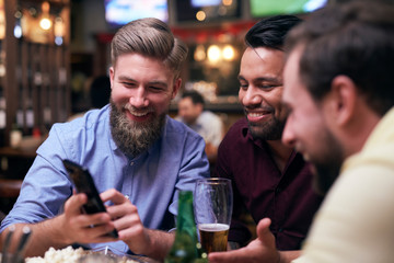 Two men spending good time in the pub
