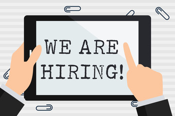 Handwriting text We Are Hiring. Conceptual photo recently you employ someone or pay someone to do particular job Businessman Hand Holding, Pointing and Touching Colorful Tablet Blank Screen