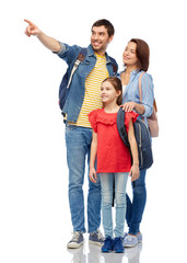 family, tourism and travel concept - happy smiling mother, father and little daughter with backpacks over white background