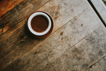 cup of coffee on wooden table