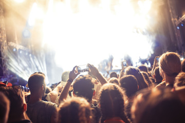 Portrait of happy crowd enjoying at music festival