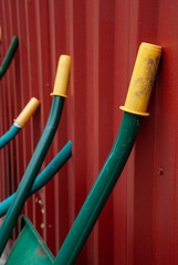 Details of work trolleys on red construction metal shed